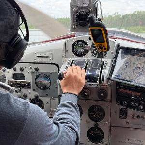 Pilot's view from the cockpit of a floatplane taking off into the Ontario wilderness.